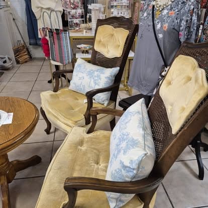 Two chairs sitting in a room together.